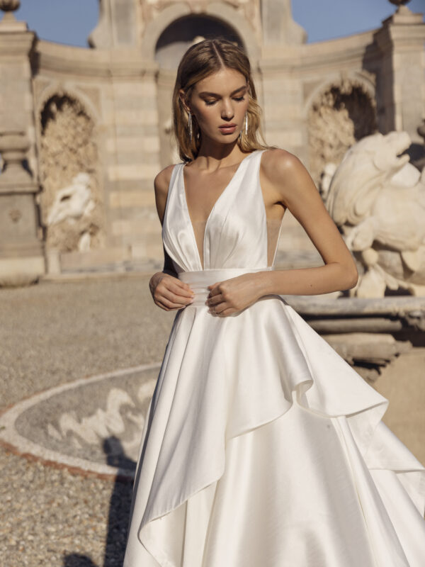 Elegant Satin A-Line Gown with Draped Overskirt & Regal Train